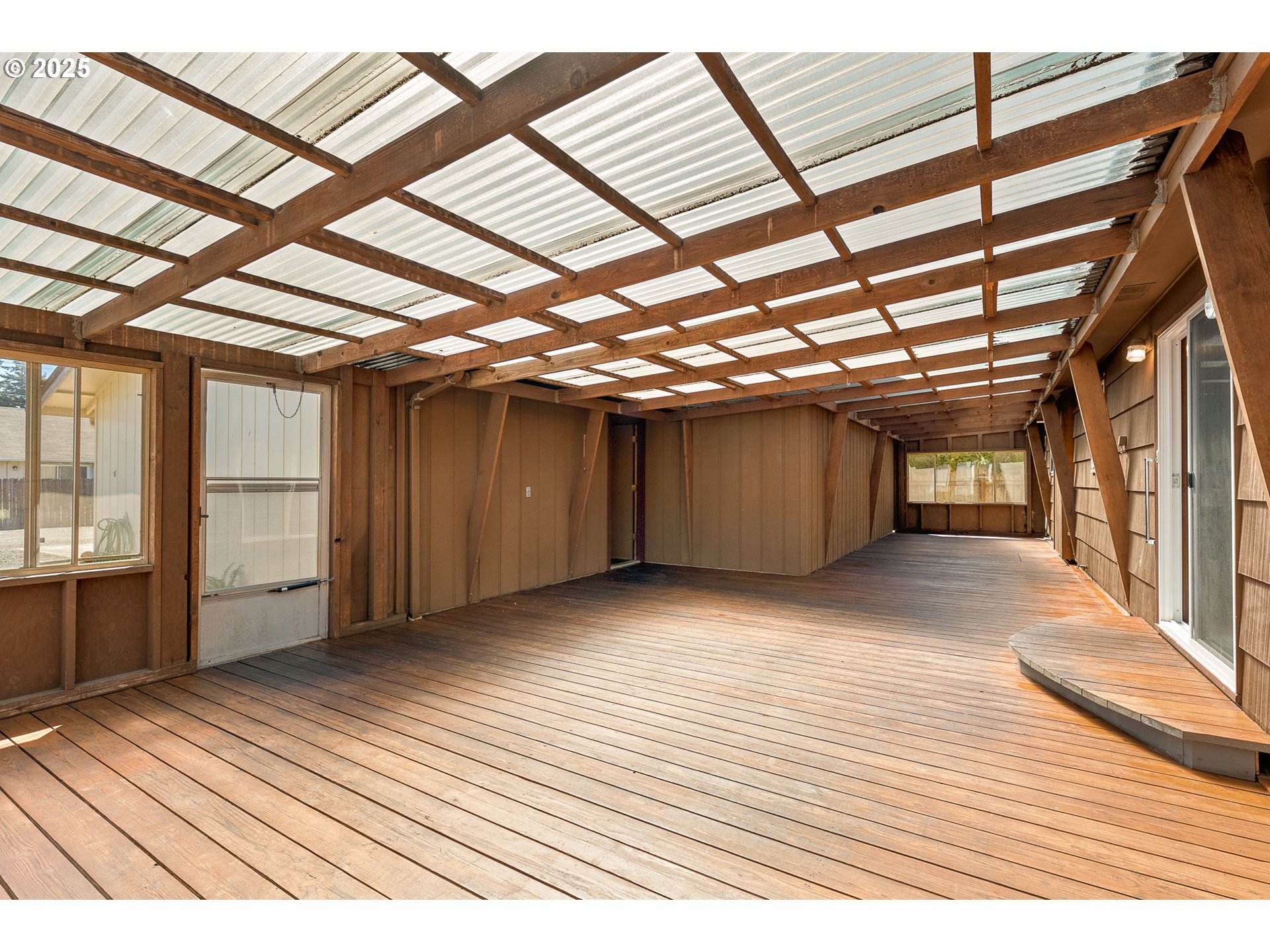 1088 Nopal Street Florence, OR 97439 - Photo 34 of 37 a view of an empty room with wooden floor