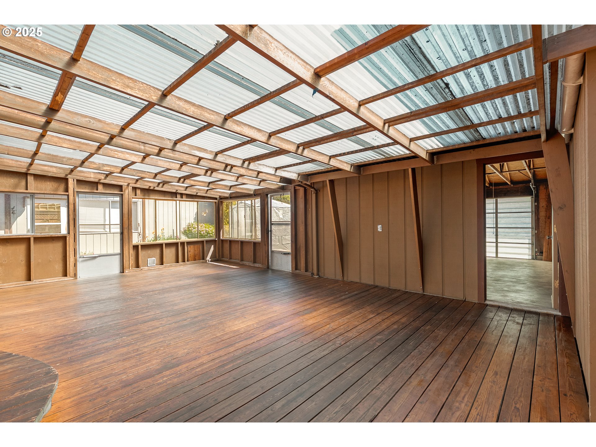 1088 Nopal Street Florence, OR 97439 - Photo 35 of 37 a view of an empty room with wooden floor