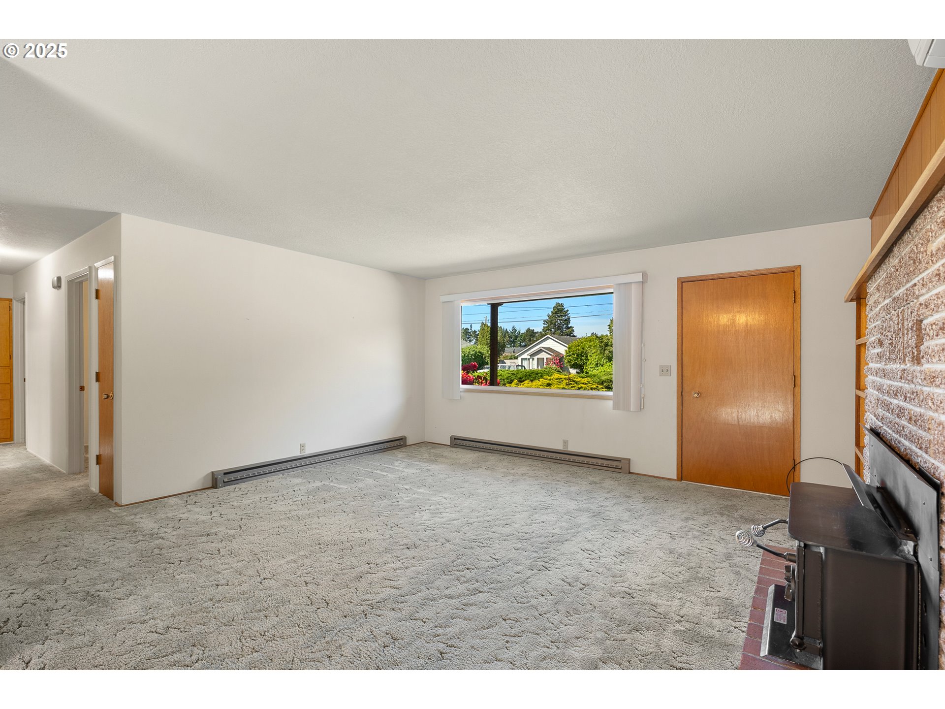 1088 Nopal Street Florence, OR 97439 - Photo 7 of 37 a view of an empty room with a window
