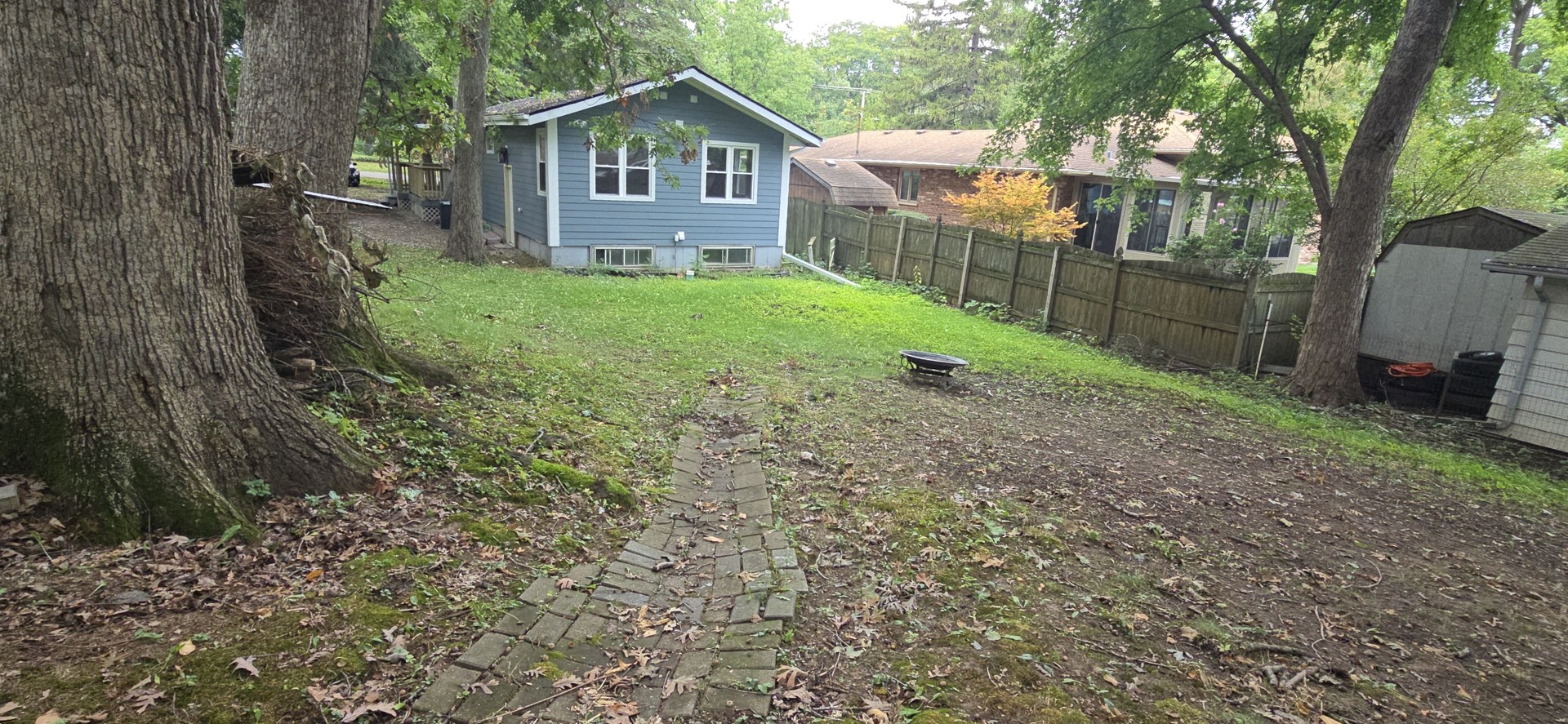 15407 Kenton Avenue Oak Forest, IL 60452 - Photo 17 of 20 a view of a yard in front of a house with large trees