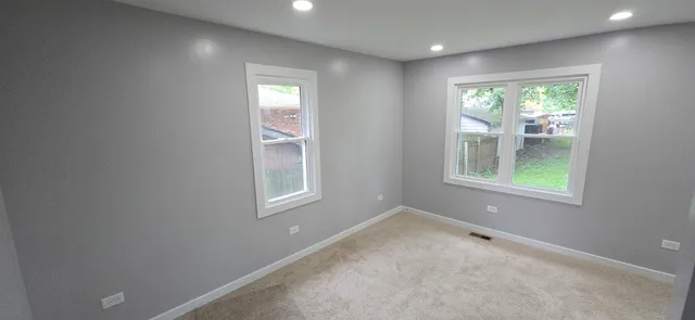 an empty room with windows