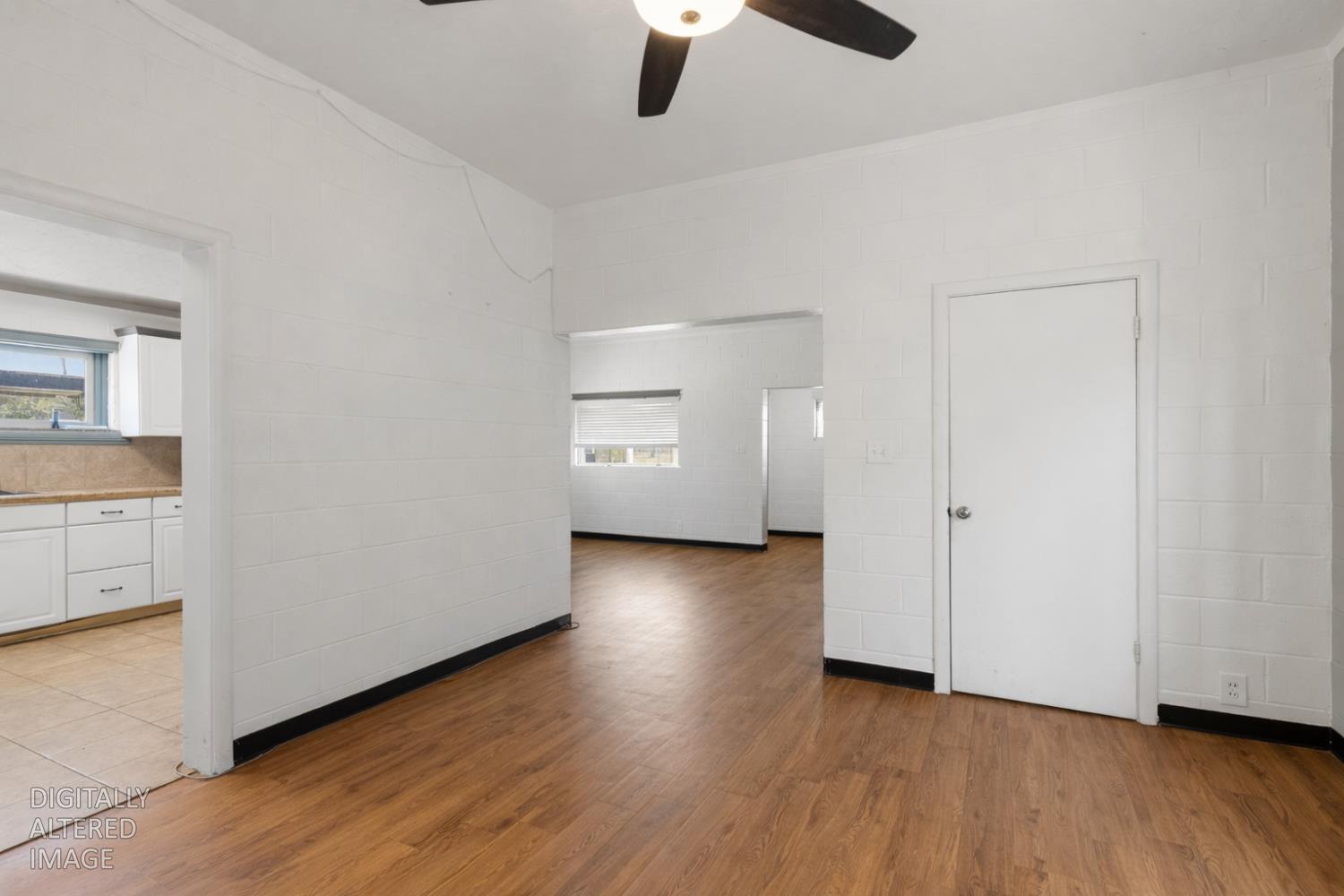 724 Webster Street Colusa, CA 95932 - Photo 13 of 48 an empty room with wooden floor cabinet and windows