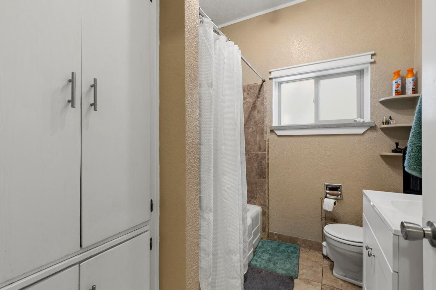 724 Webster Street Colusa, CA 95932 - Photo 16 of 48 a white toilet sitting next to a bathroom sink