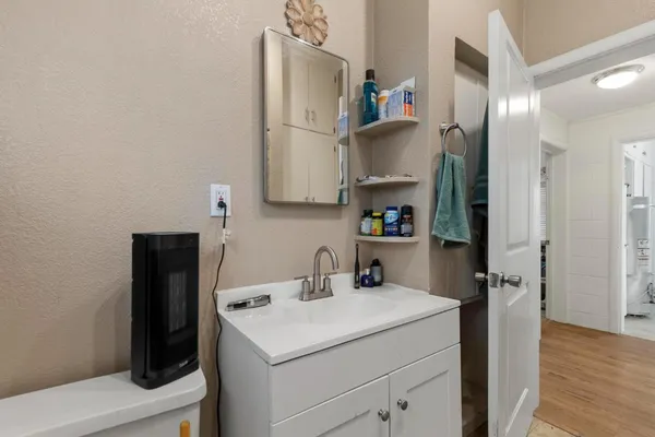 a kitchen with refrigerator and cabinets
