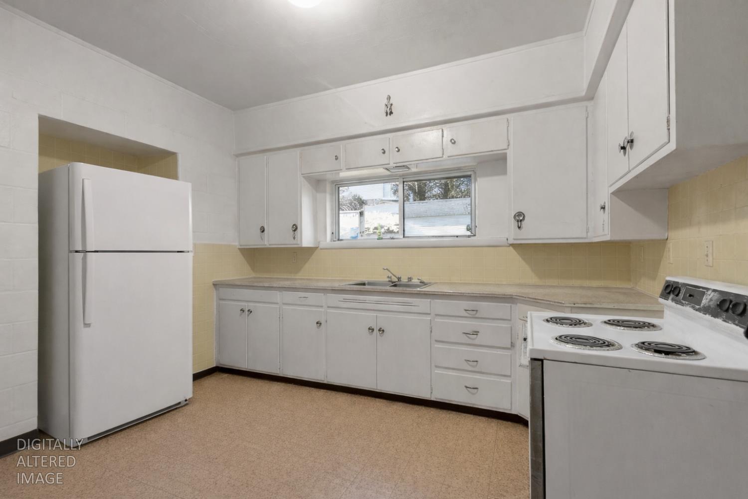 724 Webster Street Colusa, CA 95932 - Photo 33 of 48 a kitchen with granite countertop cabinets appliances a sink and a window