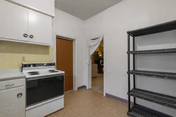 a kitchen with stainless steel appliances granite countertop a sink and a stove