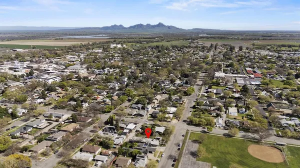 an aerial view of residential houses with outdoor space