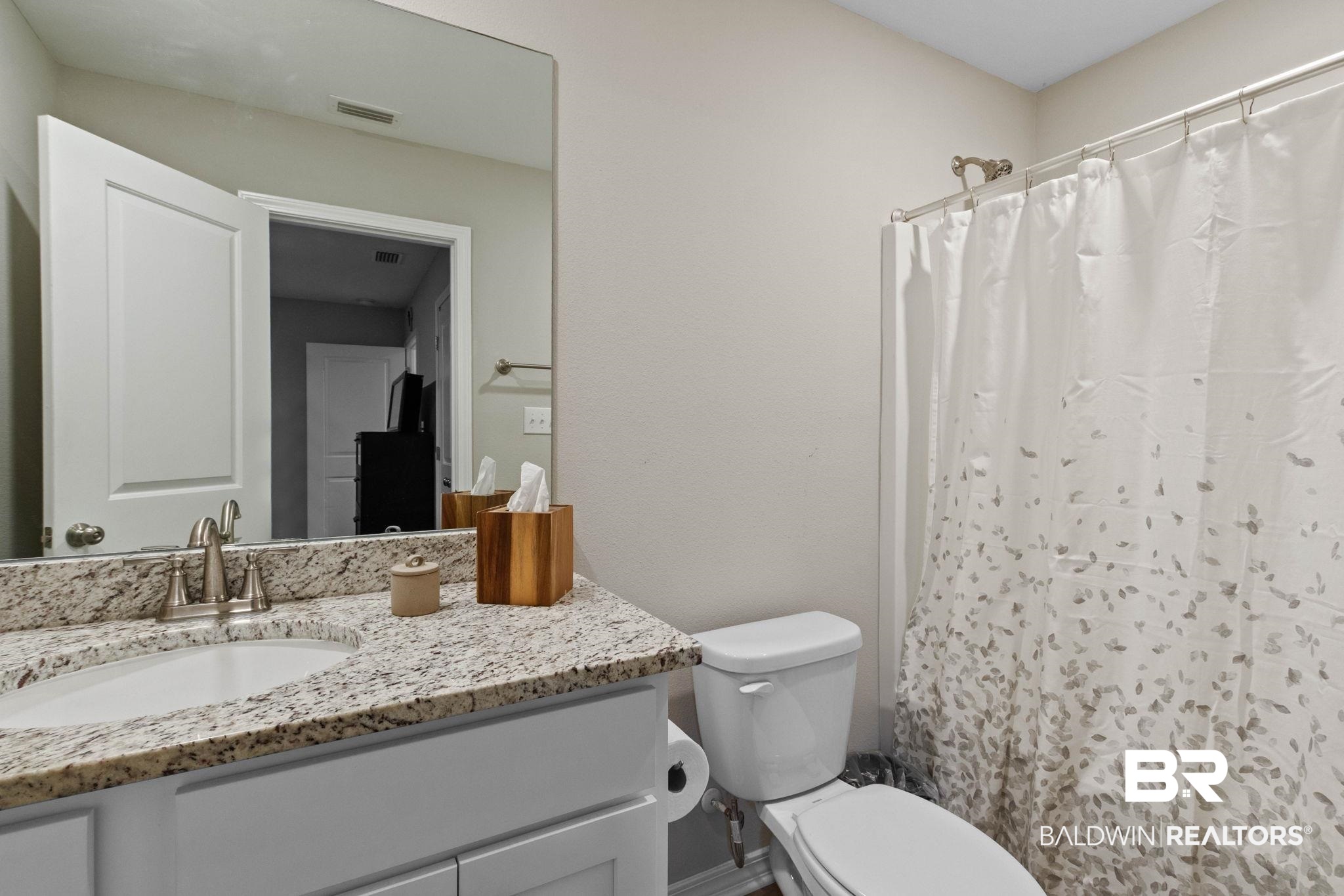 1203 Hayward Loop Foley, AL 36535 - Photo 29 of 41 Bathroom featuring vanity and a shower with curtain
