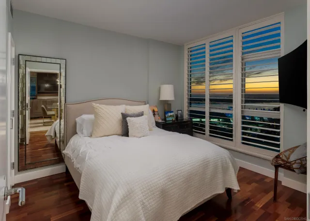 a city view from a balcony with wooden floor