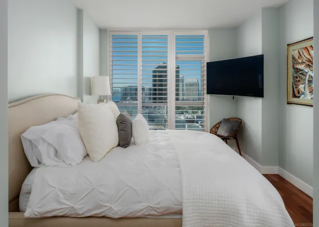 a view of a chairs and table in the balcony