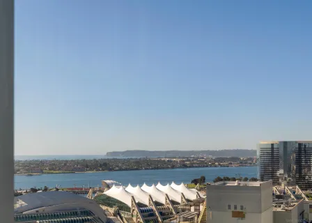 a view of a chairs and table in backyard of the building