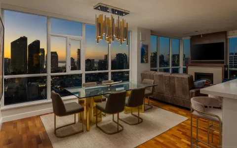 a living room with fireplace furniture and a flat screen tv