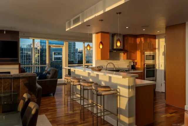 a kitchen with stainless steel appliances granite countertop a stove and a sink