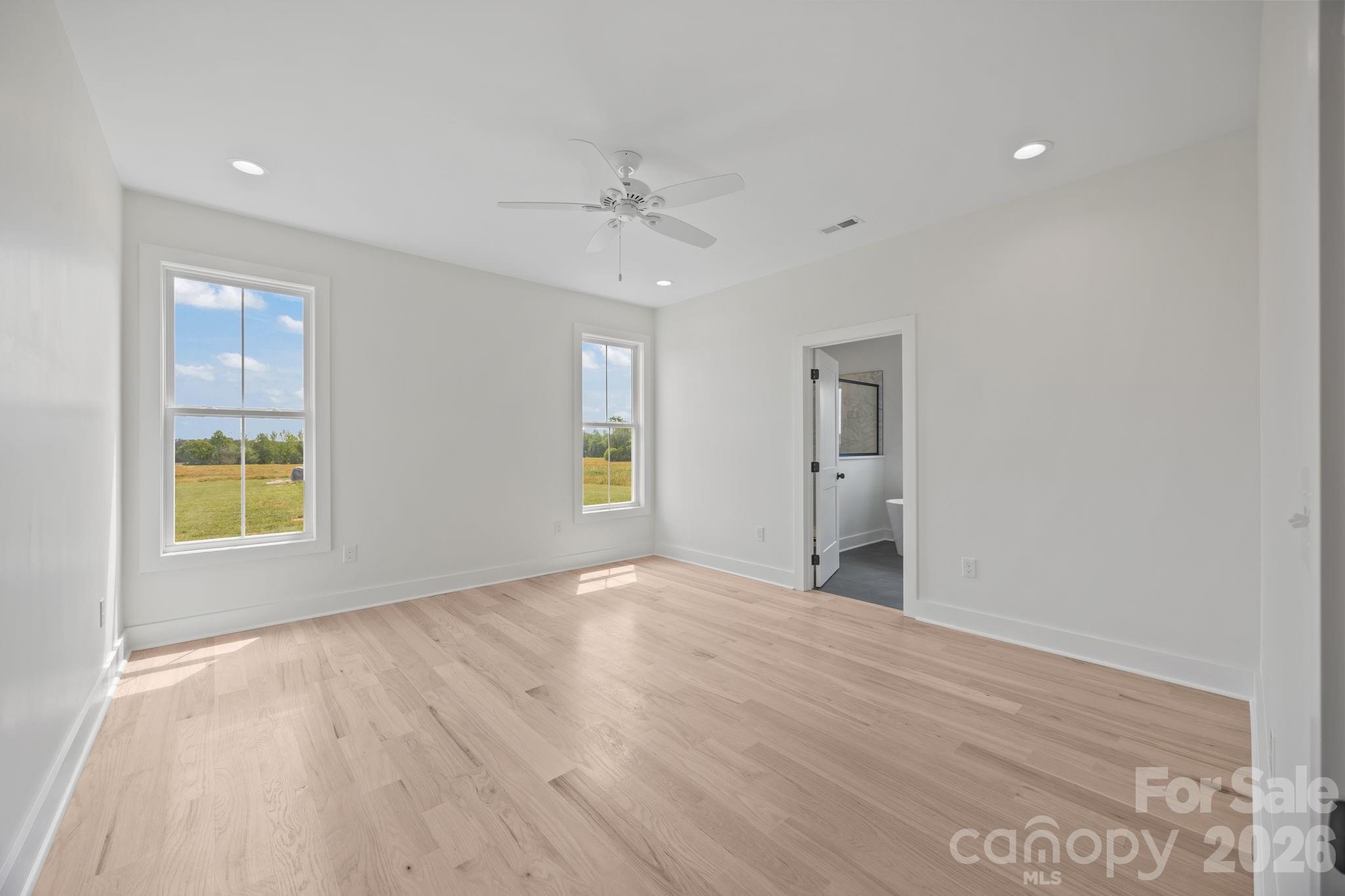 4805 Patterson Road China Grove, NC 28023 - Photo 22 of 42 a view of an empty room with a window and wooden floor