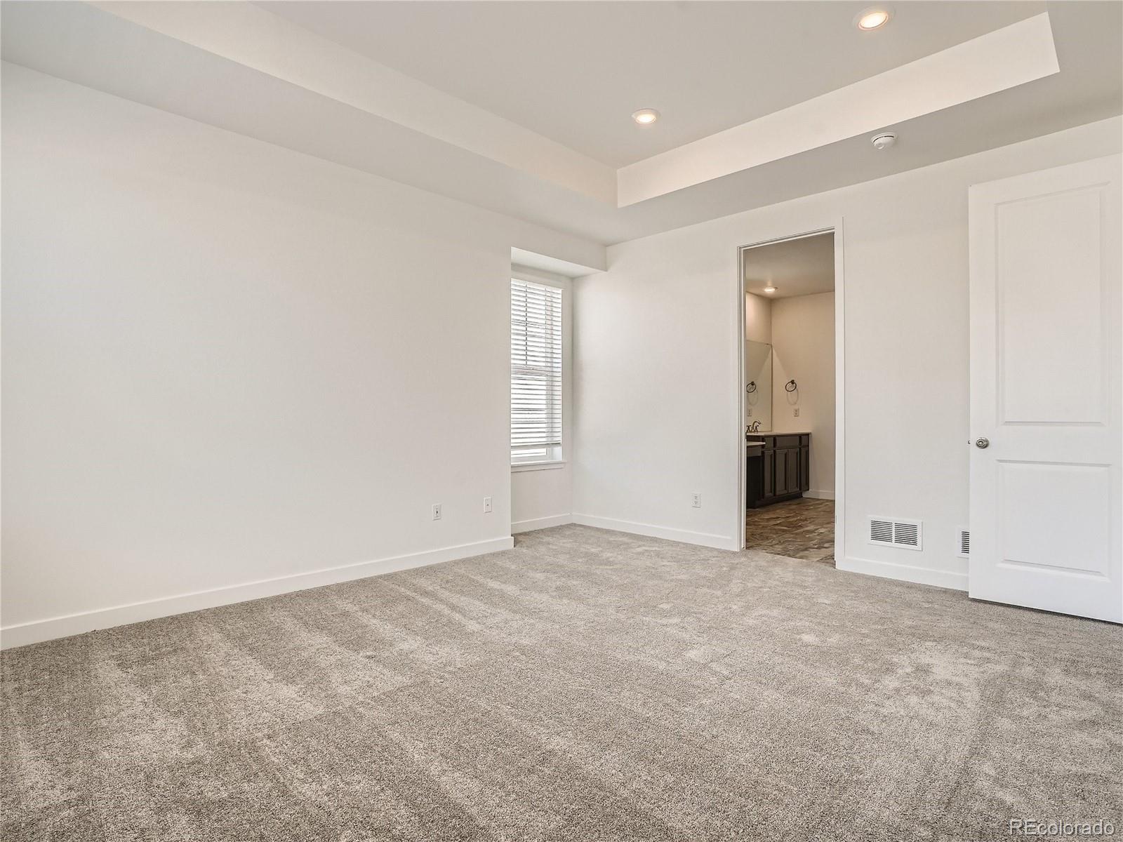 9975 Uvalda Street Commerce City, CO 80022 - Photo 15 of 29 an empty room with an entryway