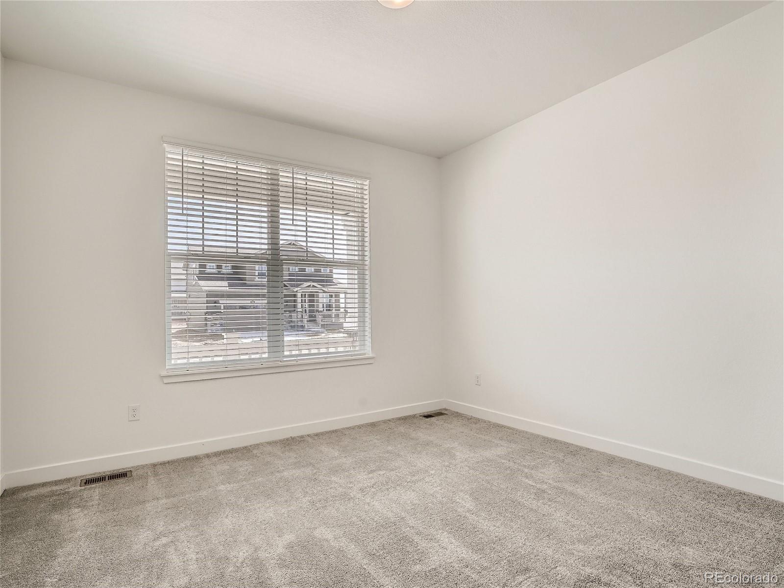 9975 Uvalda Street Commerce City, CO 80022 - Photo 19 of 29 an empty room with a window