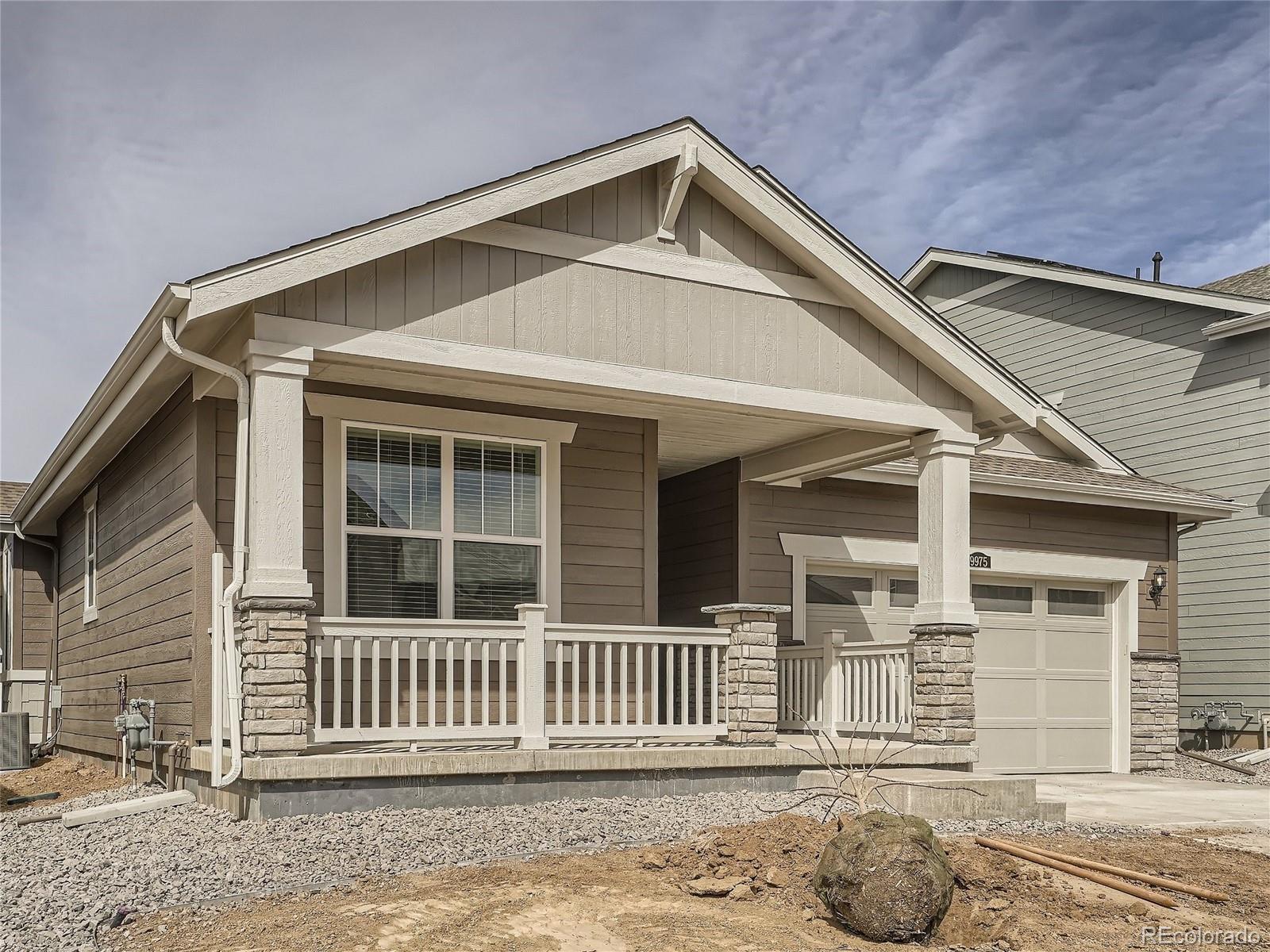 9975 Uvalda Street Commerce City, CO 80022 - Photo 2 of 29 a front view of a house