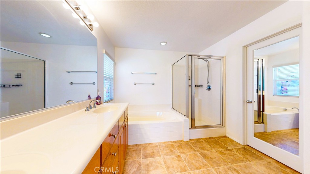 1279 Longbranch Road San Jacinto, CA 92582 - Photo 18 of 35 a spacious bathroom with a tub sink and shower