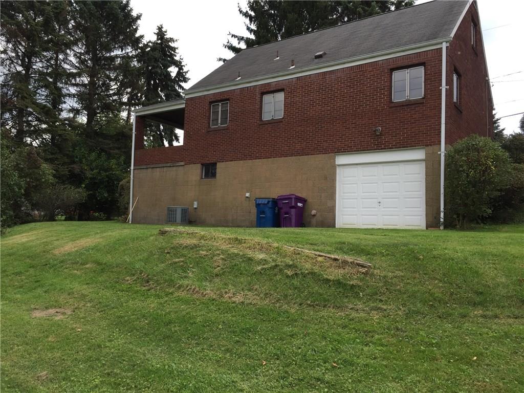 545 Center Hill Road Plum, PA 15239 - Photo 2 of 14 The back view of the home shows the newer garage door