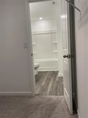a bathroom with a tub and shower