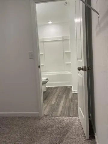 a bathroom with a tub and shower