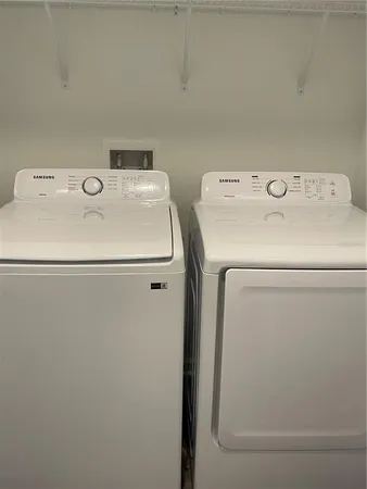 a utility room with dryer and washer