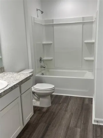 a bathroom with a toilet a sink and view