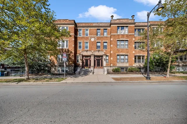 a front view of a building with street view