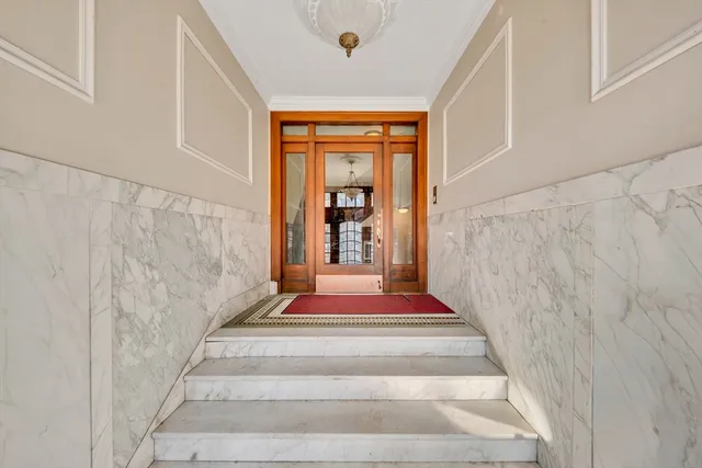 a spacious bathroom with a tub and window