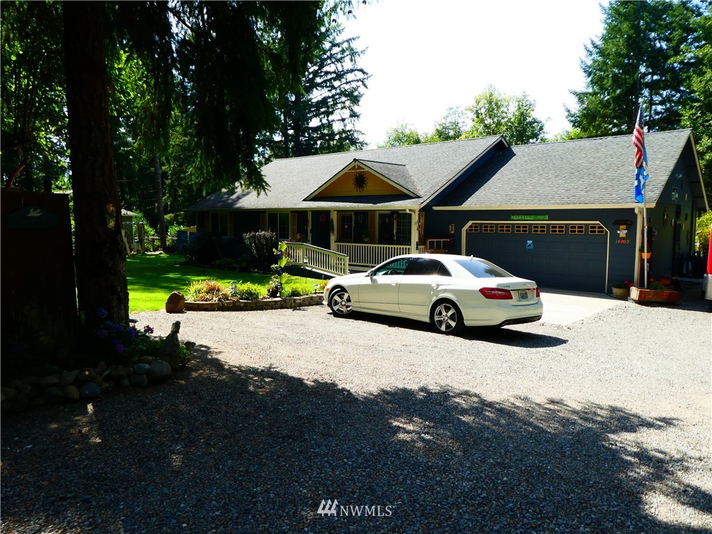 14109 Littlerock Road Southwest Rochester, WA 98579 - Photo 1 of 22 a white car parked in front of a house