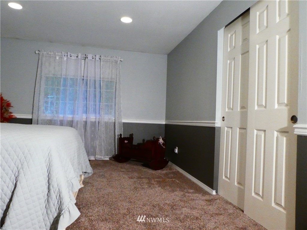 14109 Littlerock Road Southwest Rochester, WA 98579 - Photo 6 of 22 a bedroom with a bed and a closet