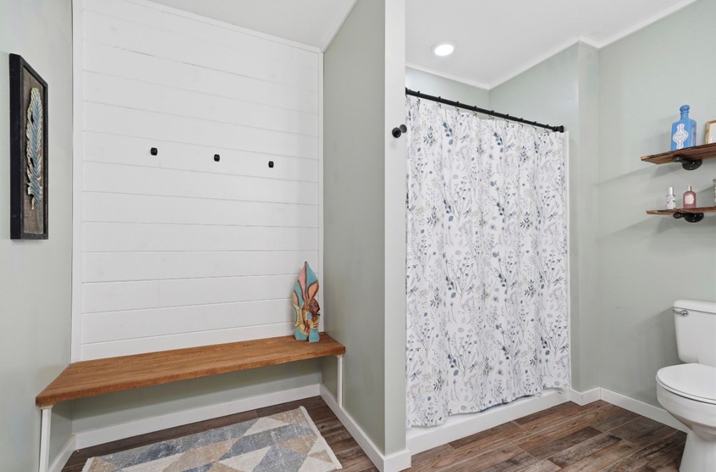 178 Windy Valley Lane Blue Ridge, GA 30513 - Photo 18 of 37 a bathroom with a shower curtain and a toilet