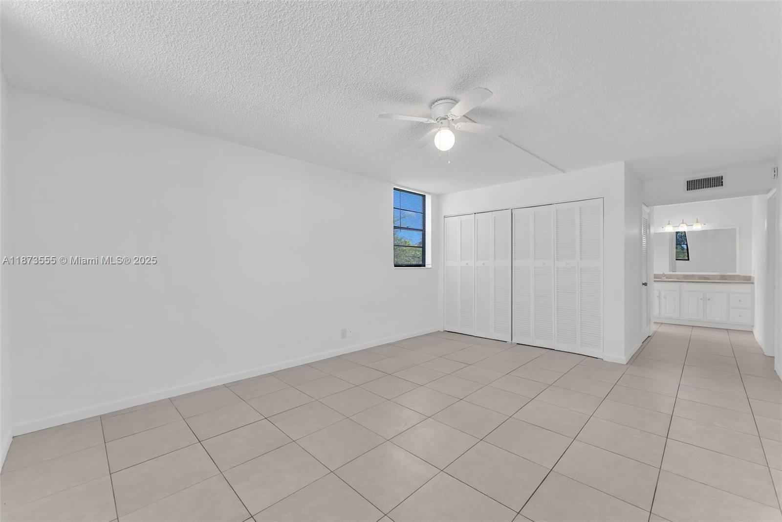 3100 North Pine Island Road, Unit 304 Sunrise, FL 33351 - Photo 16 of 24 a view of an empty room with a fan