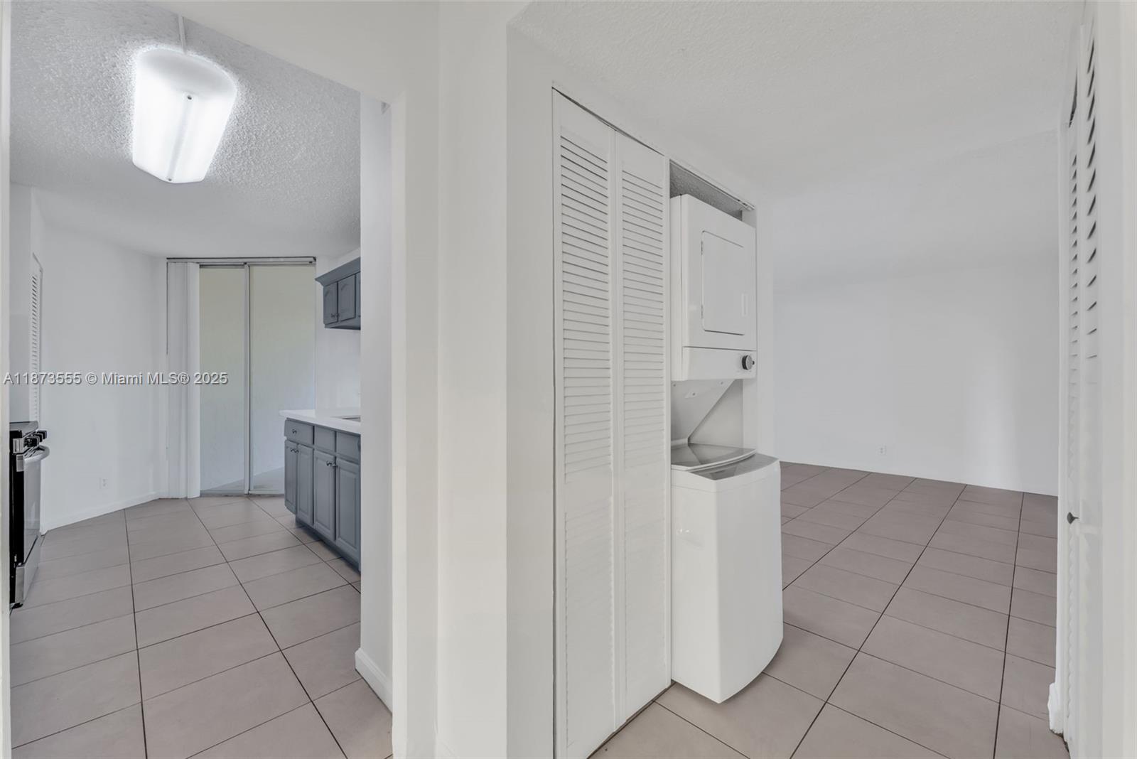 3100 North Pine Island Road, Unit 304 Sunrise, FL 33351 - Photo 17 of 24 a view of empty room with a fireplace and cabinet