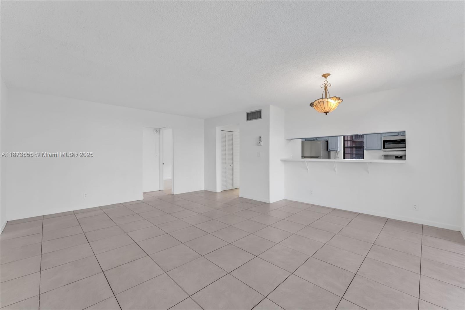 3100 North Pine Island Road, Unit 304 Sunrise, FL 33351 - Photo 18 of 24 a view of an empty room with a window