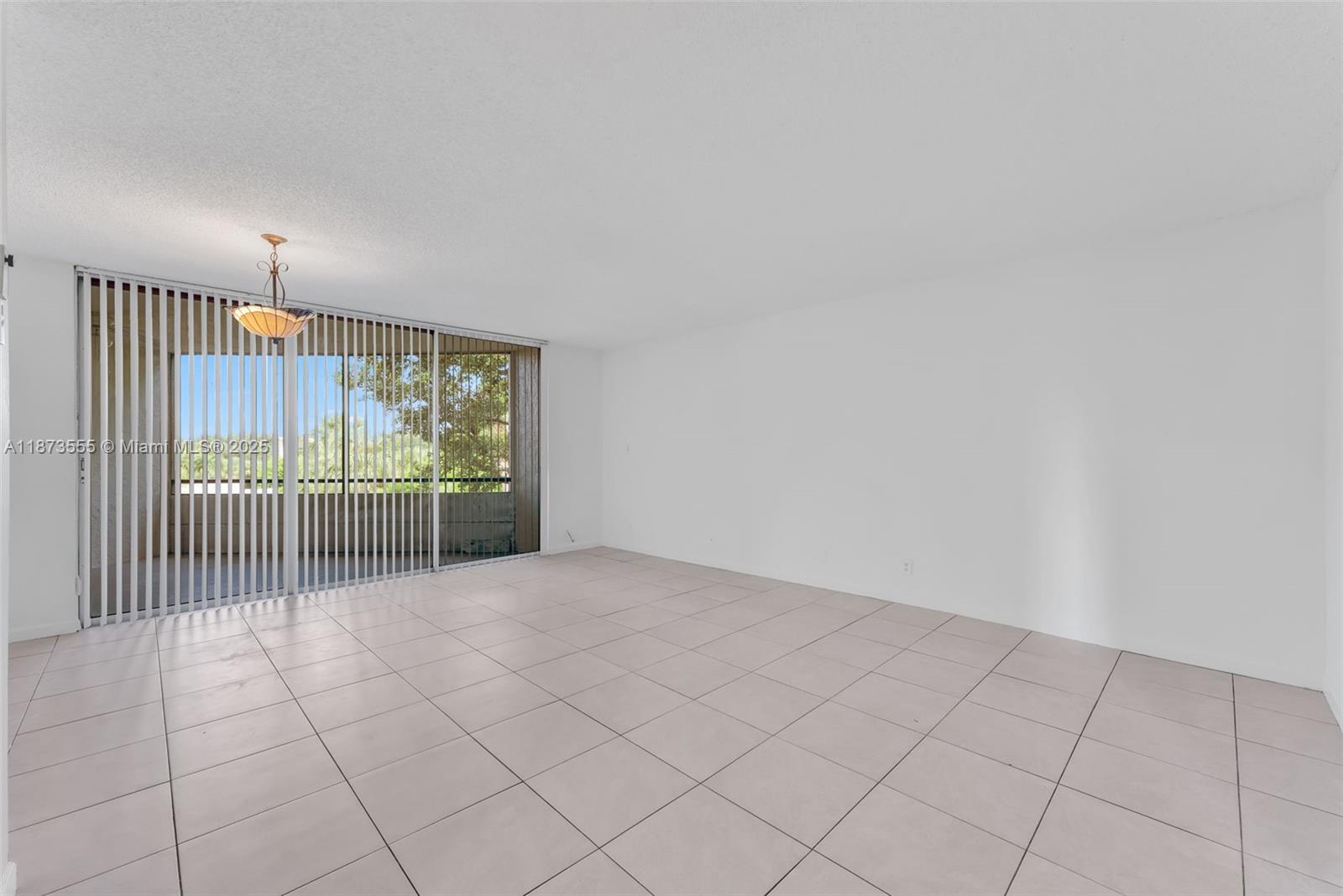 3100 North Pine Island Road, Unit 304 Sunrise, FL 33351 - Photo 19 of 24 a view of an empty room and a window