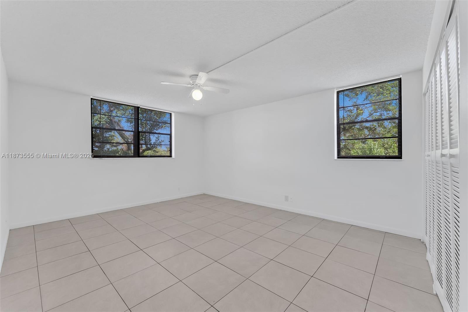 3100 North Pine Island Road, Unit 304 Sunrise, FL 33351 - Photo 10 of 24 a view of an empty room with a window