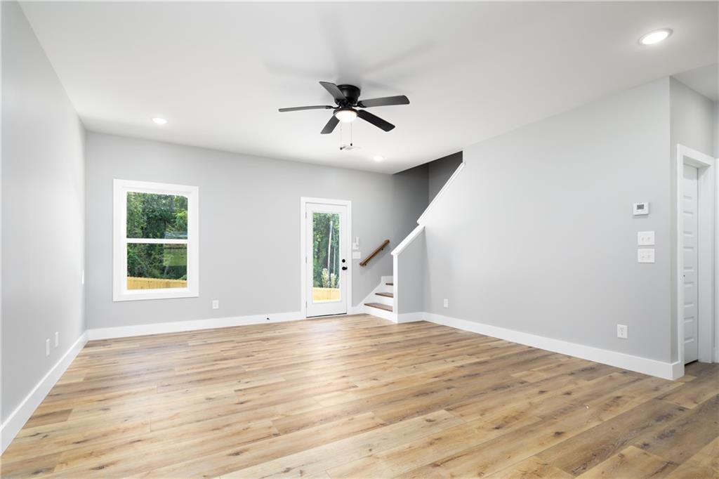 111 Lee Road Phenix City, AL 36867 - Photo 8 of 23 Spacious interior with wood-finish flooring, recessed lighting, and a modern ceiling fan