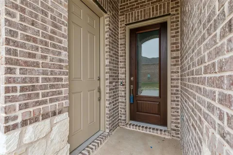 a front view of a house with a glass door