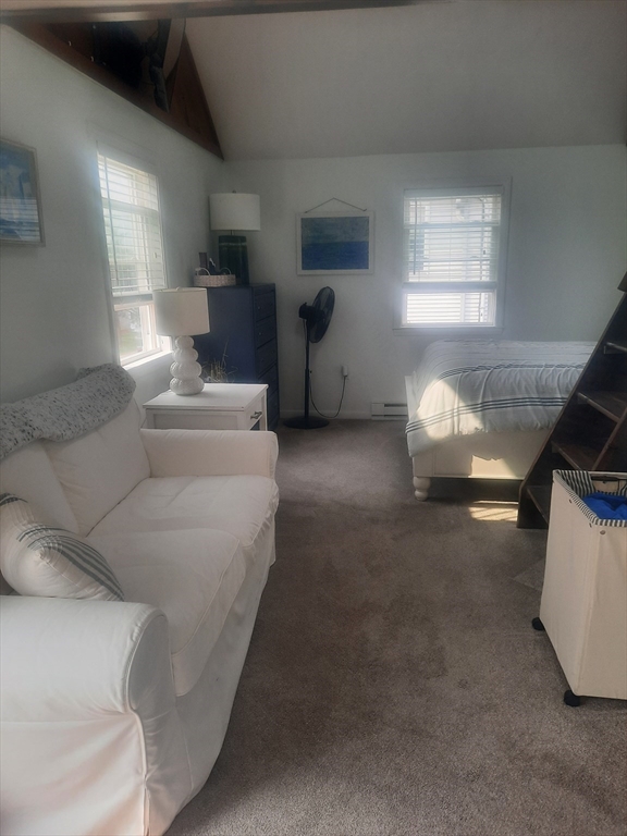 24 Pine Point Road, Unit 24 Duxbury, MA 02332 - Photo 8 of 12 a living room with furniture and a window