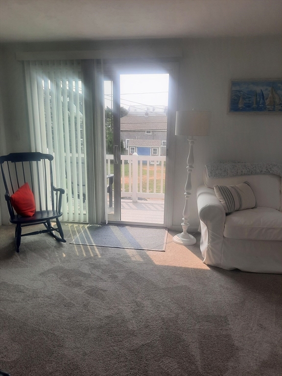 24 Pine Point Road, Unit 24 Duxbury, MA 02332 - Photo 10 of 12 a living room with furniture and a window