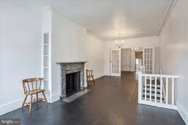 a view of livingroom with furniture and a fireplace