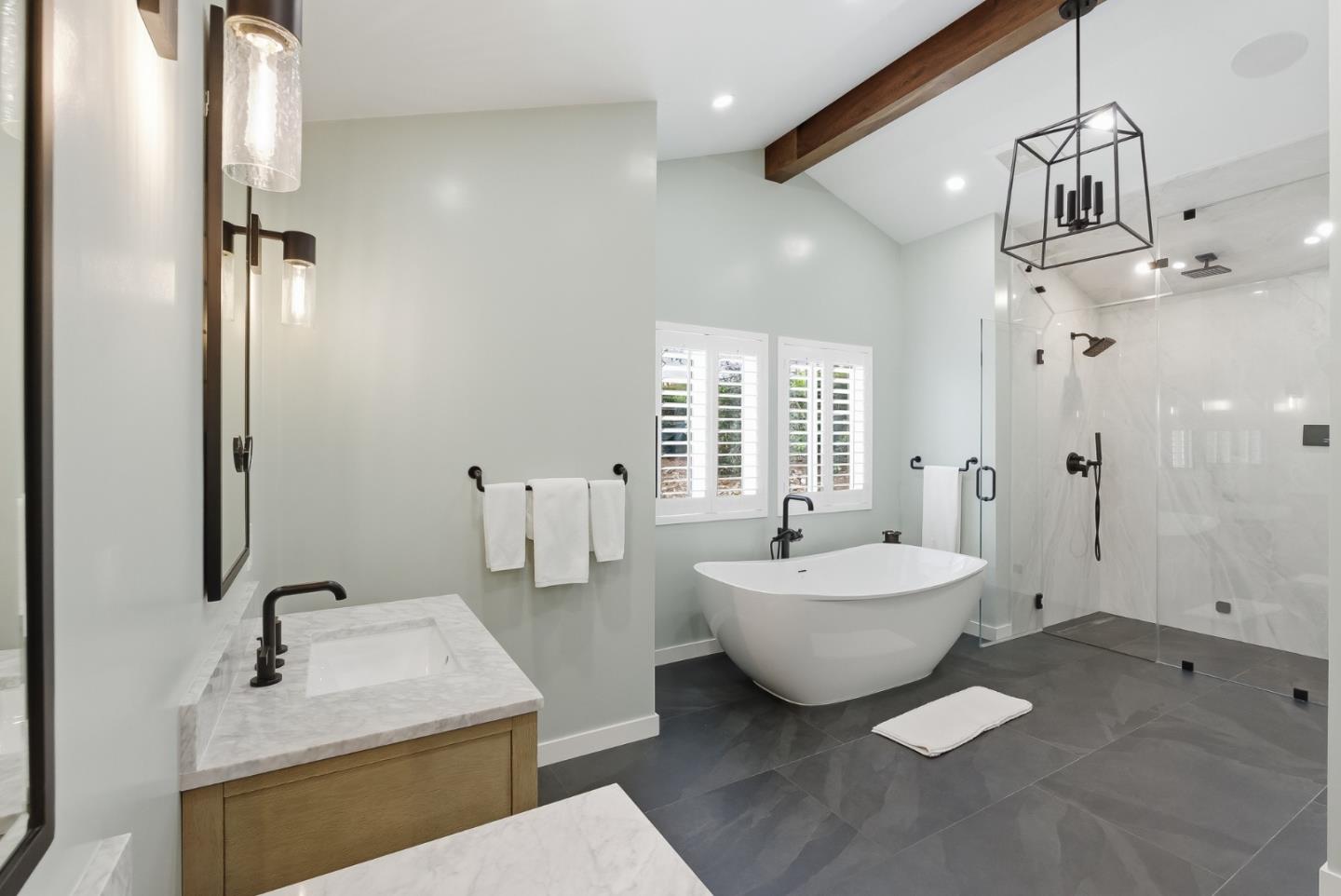 285 Ridgeway Road Woodside, CA 94062 - Photo 17 of 28 a spacious bathroom with a double vanity sink a mirror and a shower