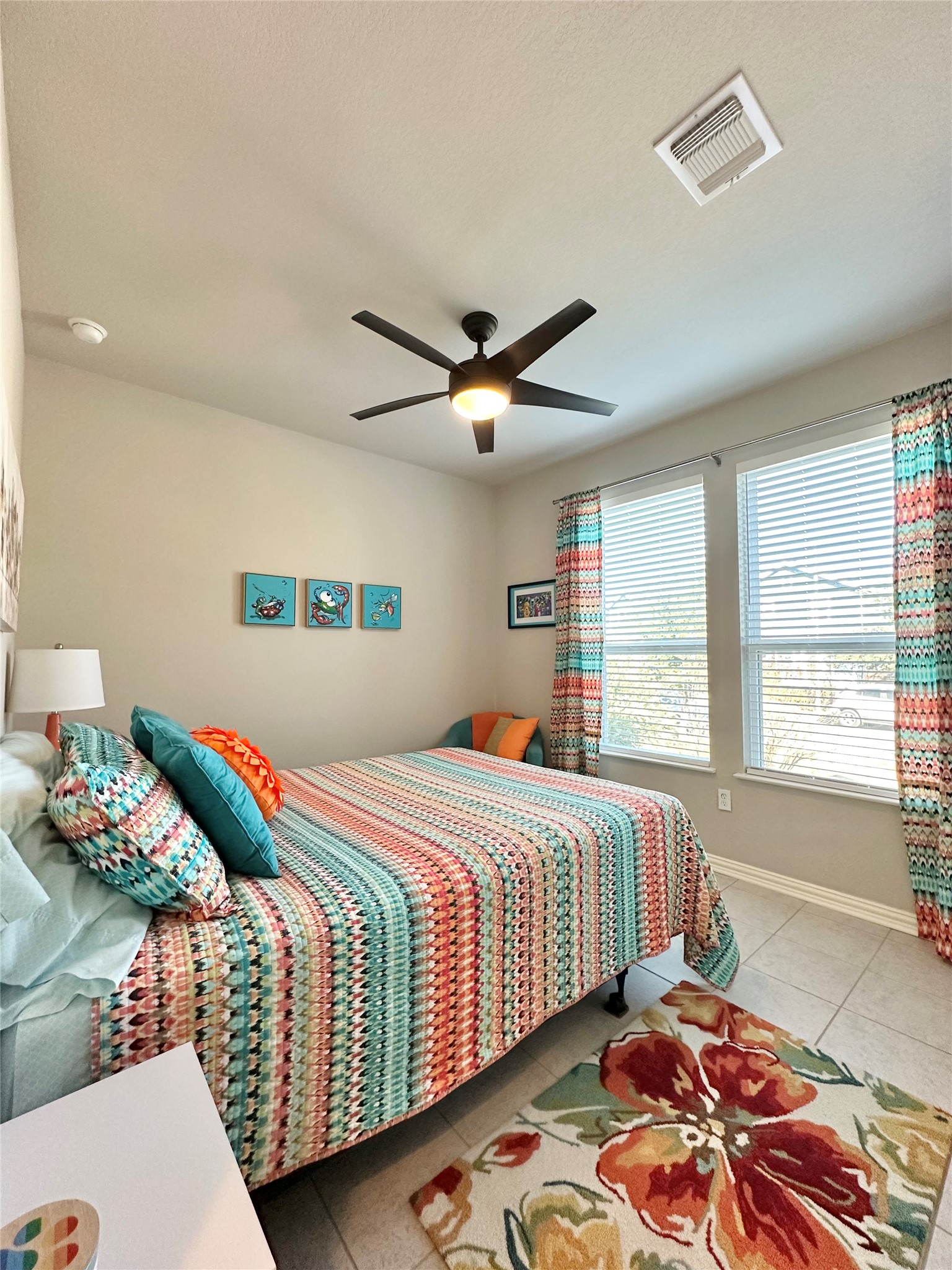 5721 Baythorne Drive Austin, TX 78747 - Photo 14 of 22 a bedroom with two beds and a window