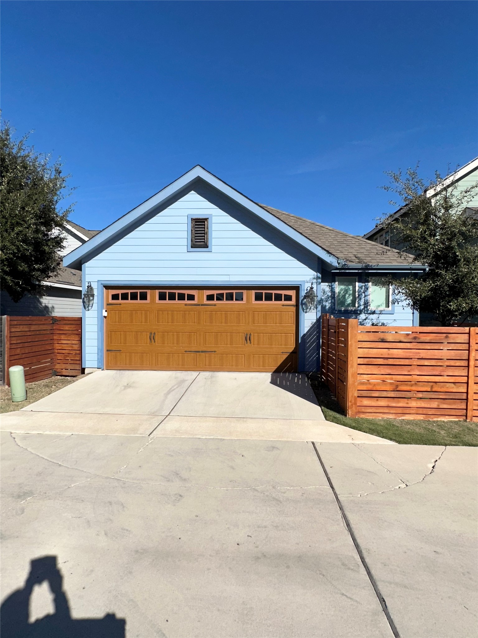 5721 Baythorne Drive Austin, TX 78747 - Photo 21 of 22 a front view of a house with a yard and garage