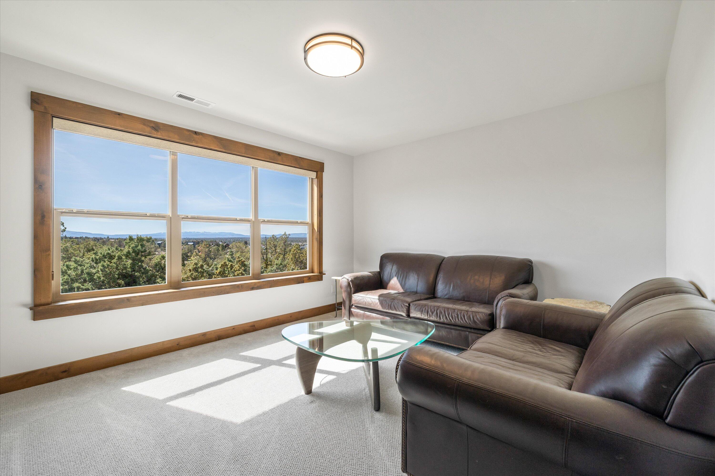 15687 Southwest Brasada Rnch Road Powell Butte, OR 97753 - Photo 50 of 73 a living room with furniture and a window