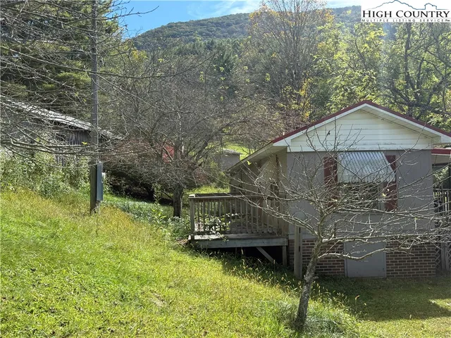 a view of a room and a floor to ceiling window in an outdoor space