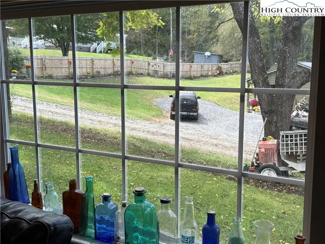 a view of house with backyard