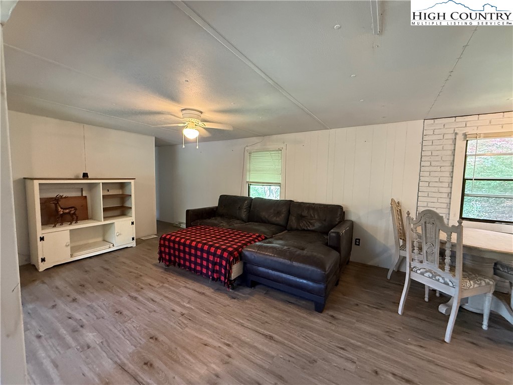 253 Bobby Rash Road Warrensville, NC 28693 - Photo 7 of 15 a living room with furniture and a fireplace