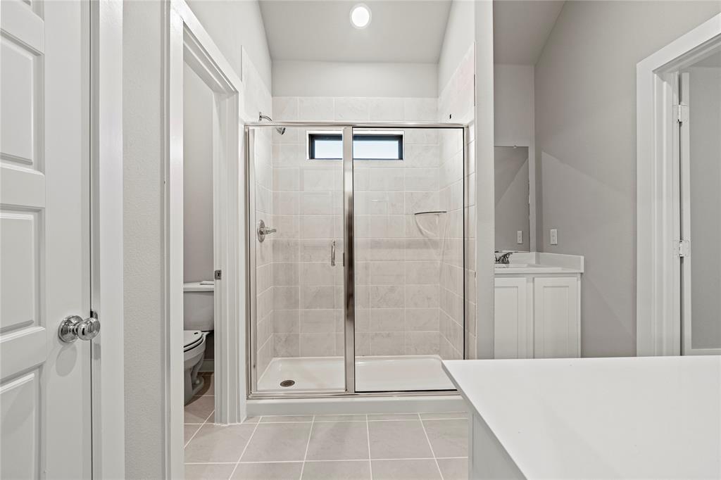4005 High Valley McKinney, TX 75071 - Photo 11 of 18 a bathroom with a shower